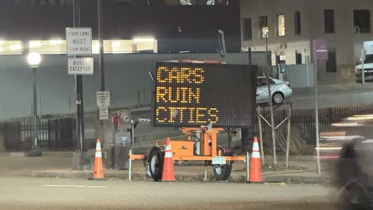 'Cars ruin cities' signs in Denver were hacked, officials say