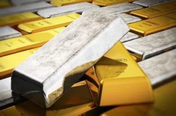 Ouro e prata em queda livre após colapso de sexta-feira nos mercados